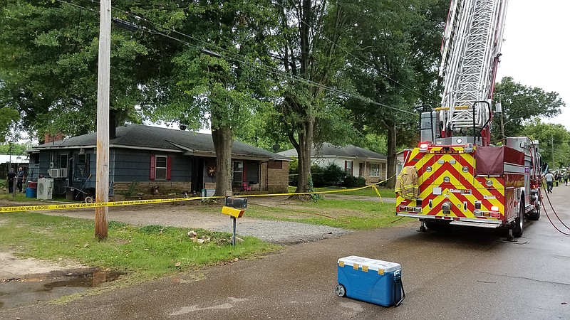 A Texarkana, Texas, Fire Department ladder truck sits in front of a house at 3011 Meadows Drive on Wednesday, June 5, 2019. A preschool-age boy died in a fire in the house. The fire is under investigation.