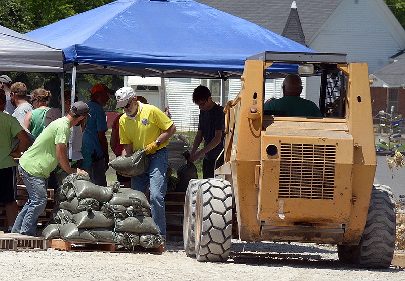 Volunteers in Hartsburg fill sandbags June 5, 2019, as the Missouri River reaches higher.