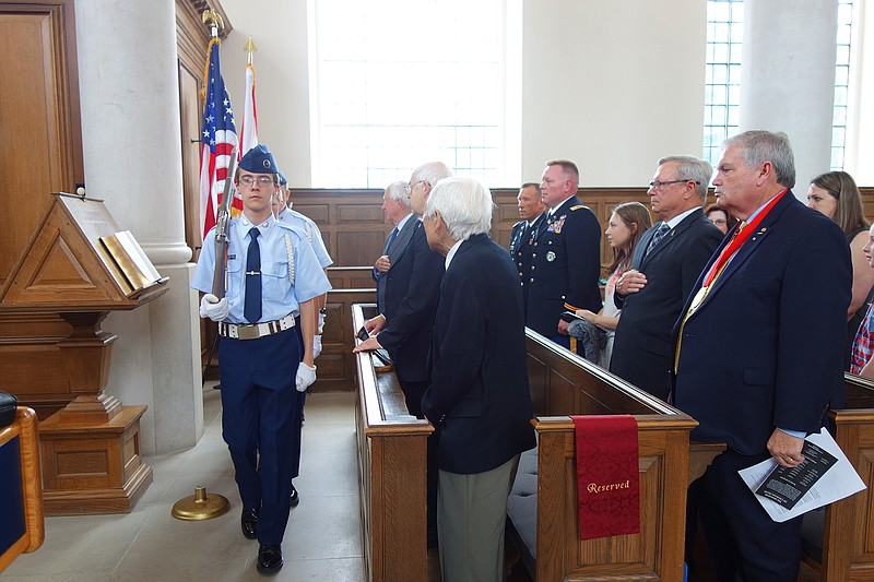 <p>Helen Wilbers/For the News Tribune</p><p>Thomas Klenke, left, of the Civil Air Patrol leads a color guard in front of veterans — including Richard Toshio Henmi, front row, foreground, and National Churchill Museum dignitaries. The museum hosted a ceremony Thursday to recognize the anniversary of D-Day.</p>