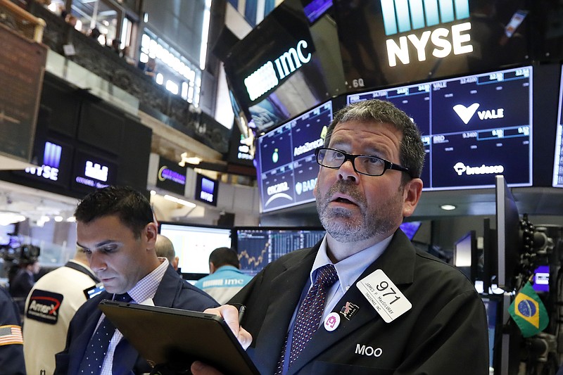 Trader James MacGilvray, right, works on the floor of the New York Stock Exchange, Thursday, June 6, 2019. Stocks are slightly higher Thursday as the market watches for the latest developments in U.S. trade disputes with China and Mexico. (AP Photo/Richard Drew)