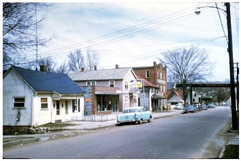 <p>A 1960 photo of the 500-600 block of Lafayette looking northwest after the construction of the Rex Whitton Expressway in the background to right.</p>