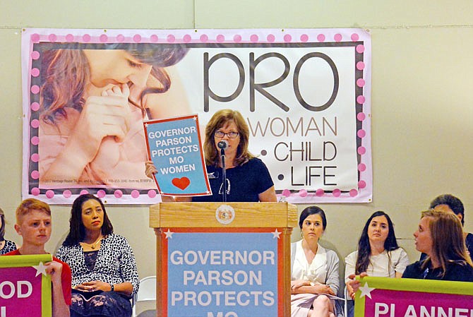 Diane Vaughan, of Thrive St. Louis Express Women's Health Care, speaks Friday during a pro-life rally in the Capitol Rotunda. 