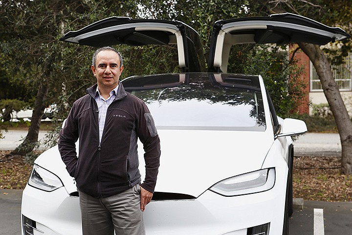 Miguel Casillas, founder and executive director of SV Links, with his Tesla X that he rents out using Turo, a vehicle-sharing platform on March 15, 2017, in Menlo Park, Calif. Turo allows Casillas to receive rental income from his business cars when he is not using them.  Gary Reyes/Bay Area News Group/TNS