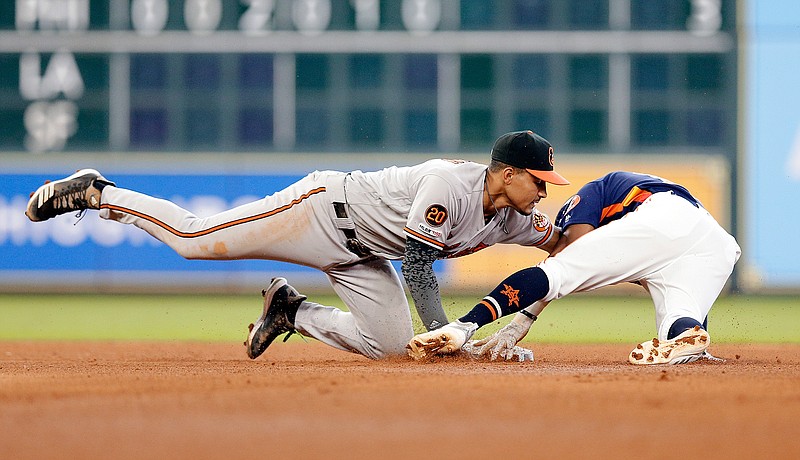 Baltimore Orioles shortstop Richie Martin, left, makes the tag on Houston Astros second baseman Tony Kemp, right, for the out at second base on Kemp's attempted steal on Sunday in Houston.