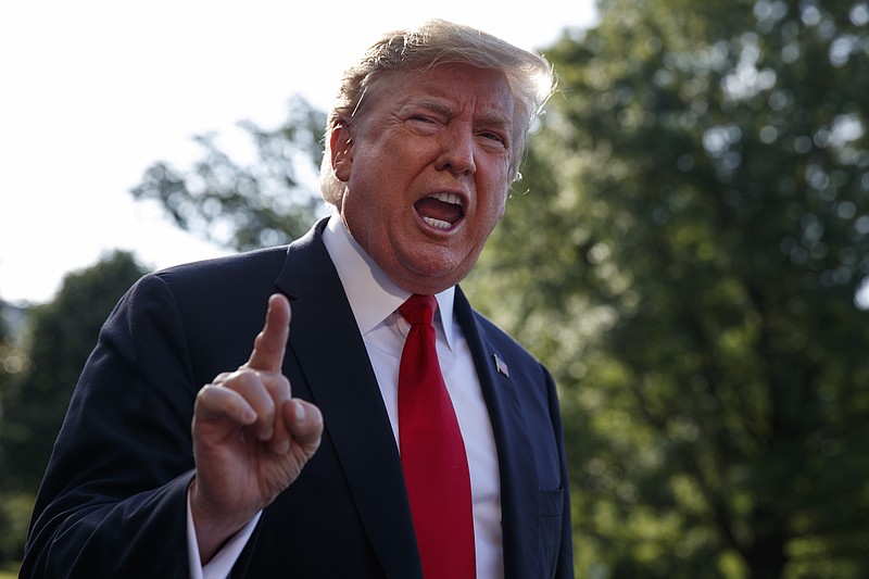 President Donald Trump talks with reporters before departing on Marine One for the Air Force Academy graduation ceremony, Thursday, May 30, 2019, in Washington. (AP Photo/Evan Vucci)