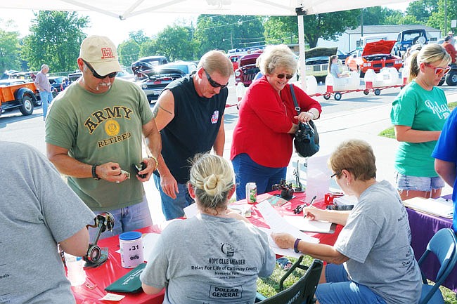 Relay for Life participants sign up before the 2018 Relay for Life. The annual fundraising event for the American Cancer Society is this Friday, 5:30-11 p.m.