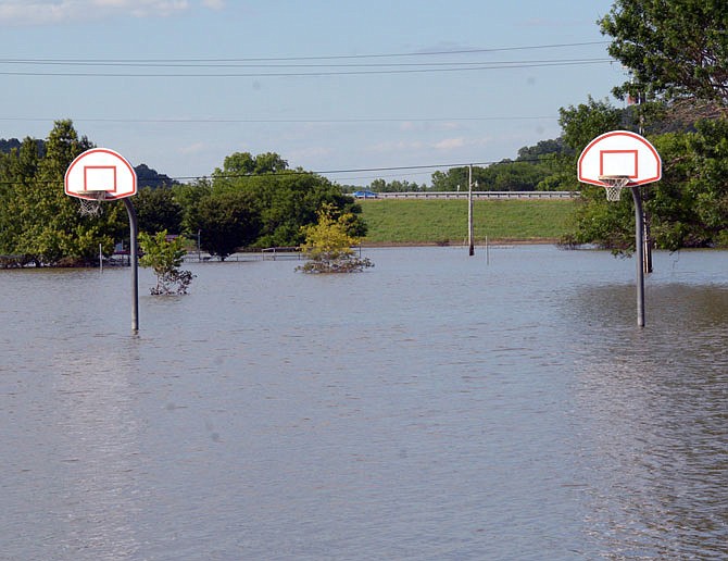 A basketball court remains submerged in floodwaters Tuesday at the North Jefferson Recreation Area.