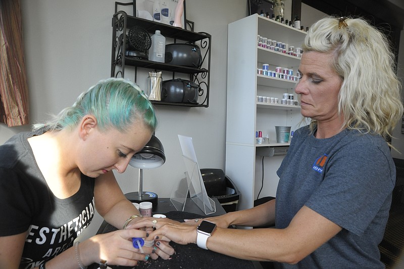 Tara Renfro gets a gel dip powder at Exhale Spa by esthetician Mary Kemna.