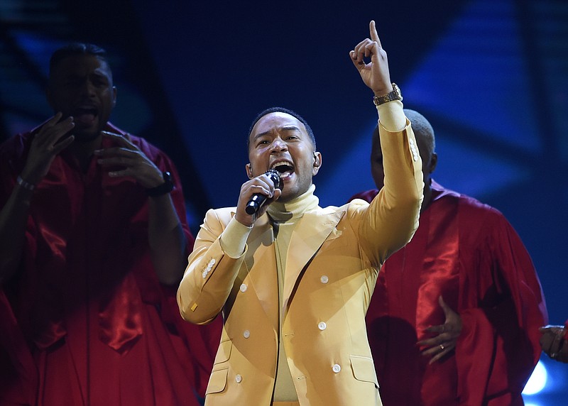 FILE - In this March 14, 2019, file photo, John Legend performs "Preach" at the iHeartRadio Music Awards at the Microsoft Theater in Los Angeles. Legend says Hollywood should consider boycotting Georgia, Louisiana, Alabama and other states that pass restrictive abortion laws. The Grammy and Oscar-winning singer says he isn’t sure a boycott would lead to the states changing course, but he knows that “money talks.” (Photo by Chris Pizzello/Invision/AP, File)