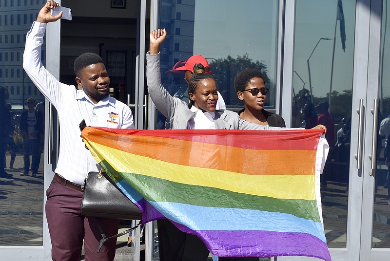 Activists celebrate outside the High Court in Gaborone, Botswana, Tuesday June 11, 2019. Botswana became the latest country to decriminalize gay sex when the High Court rejected as unconstitutional sections of the penal code that punish same-sex relations with up to seven years in prison. (AP Photo)
