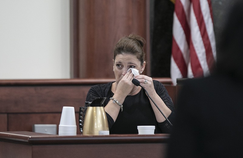 Amber Kyzer, mother of five children who were killed by their father, is questioned by 11th Circuit deputy Solicitor Suzanne Mayes during the sentencing phase of the trial of her ex-husband, Tim Jones, in Lexington, S.C., on Tuesday, June 11, 2019.  A jury convicted Jones of five counts of murder last week for the Aug. 2014 killings.  (Tracy Glantz/The State via AP, Pool)