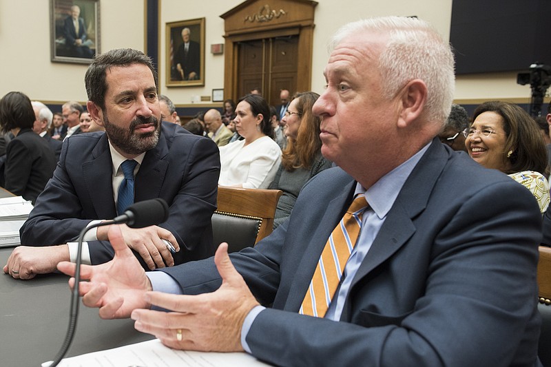 Kevin Riley, editor of the Atlanta Journal-Constitution, right, talks with David Pitofsky, General Counsel of News Corp, during their appearance before the House Judiciary Antitrust subcommittee hearing on 'Online Platforms and Market Power', on Capitol Hill in Washington, Tuesday, June 11, 2019. (AP Photo/Cliff Owen)