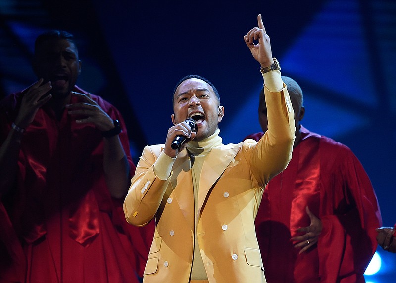 In this March 14, 2019, file photo, John Legend performs "Preach" at the iHeartRadio Music Awards at the Microsoft Theater in Los Angeles. Legend says Hollywood should consider boycotting Georgia, Louisiana, Alabama and other states that pass restrictive abortion laws. The Grammy and Oscar-winning singer says he isn't sure a boycott would lead to the states changing course, but he knows that "money talks." (Photo by Chris Pizzello/Invision/AP, File)