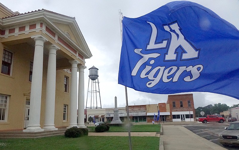 A flag adorns Cass County Courthouse in Linden, Texas, to congratulate Linden-Kildare High School for making the recent Class 2A state baseball championship in Round Rock, Texas. The Tigers were runners-up to repeating champion Dallardsville Big Sandy.