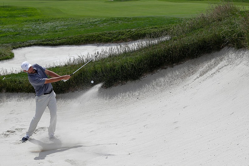 Brooks Koepka hits out of the bunker on the first hole during a practice round for the U.S. Open Championship golf tournament Tuesday, June 11, 2019, in Pebble Beach, Calif. (AP Photo/Matt York)