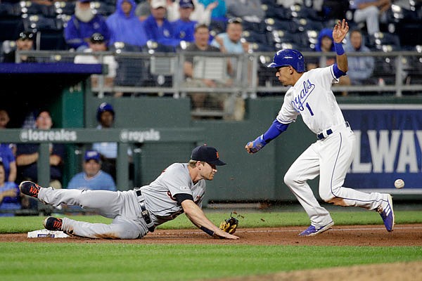 Nicky Lopez of the Royals beats the tag by Tigers third baseman Brandon Dixon during the eighth inning of Tuesday night's game at Kauffman Stadium.