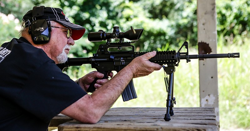 Jim Stayton fires an AR-15 at a target at the Smith Park gun range on Wednesday, June 12, 2019, in Doddridge, Arkansas. Stayton comes to the range from time to time to fire his guns for fun.