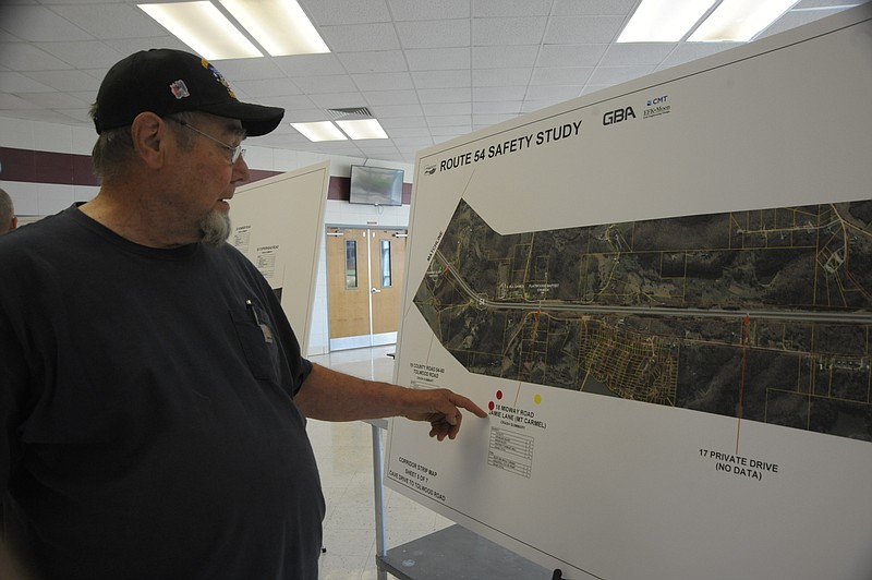 <p>Danisha Hogue/News Tribune</p><p>Ralph Beach reviews the map of intersection 18 Midway Road and Jamie Lane. A Missouri Department of Trasportation public comment meeting was Wednesday evening at Eldon High School.</p>