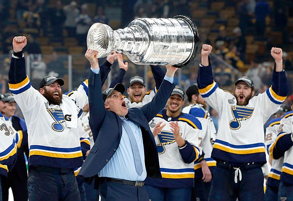 Blues head coach Craig Berube carries the Stanley Cup after the Blues defeated the Bruins 4-1 in Game 7 of the Stanley Cup Final in Boston. It is the Blues' first Stanley Cup championship in franchise history.