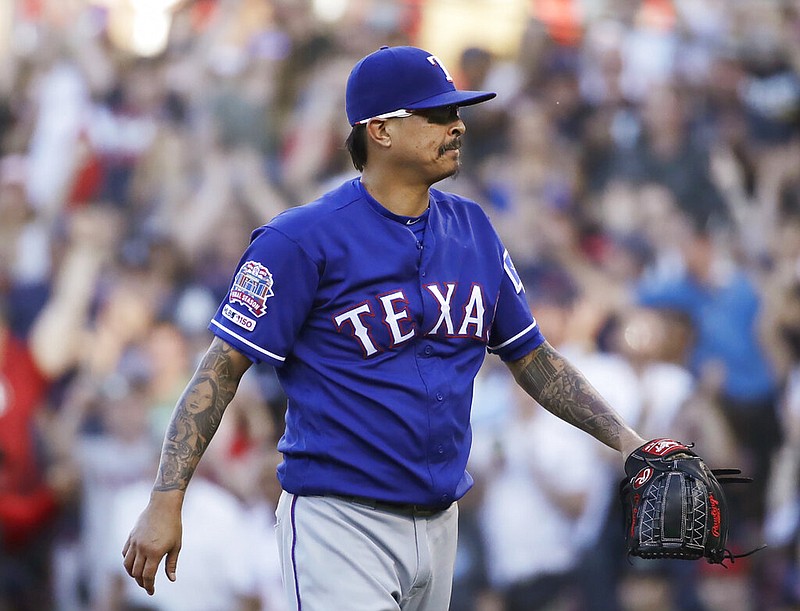 Texas Rangers relief pitcher Jesse Chavez leaves the mound after giving up walk to Boston Red Sox's Mookie Betts that drove in the winning run in a baseball game at Fenway Park, Wednesday, June 12, 2019, in Boston. The Red Sox won 4-3. 