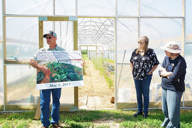Peter Sutter's (left) greenhouse garden has seen better days. This year, it's being slowly wiped out by herbicide, contaminating a recent load of soil. 