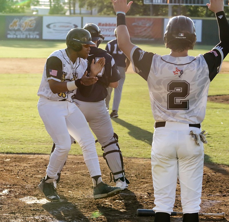  Texarkana Twins' Lee Thomas celebrates after scoring a run against the Brazos Valley Bombers on Wednesday, June 12 at George Dobson Field in Texarkana, Texas.
