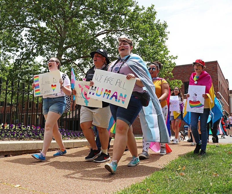 
Raygen Fox, front left, Eli Robinette, front center, and Ash Stickann, front right, lead the SAGA March down High Street Saturday. SAGA, a teen-led group dedicated to discussing the importance of LGBTQ+ support and acceptance, meets every first and third Wednesday of the month in the Truman Room of the Missouri River Regional Library.