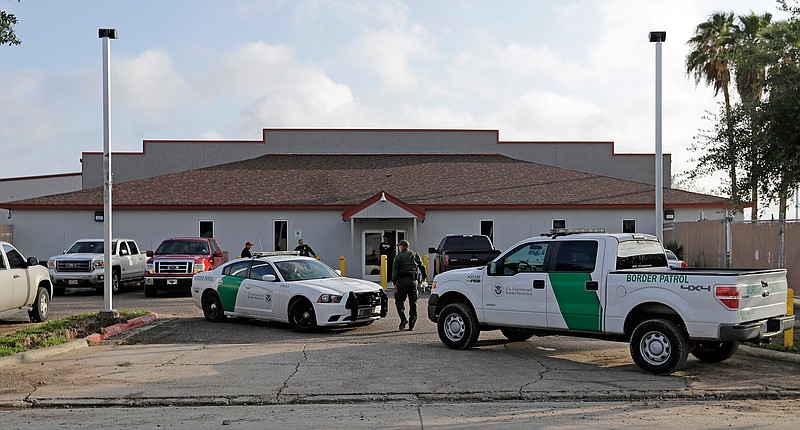 A U.S. Border Patrol Agent walks between vehicles June 23, 2018, outside the Central Processing Center in McAllen, Texas. Advocates were shocked to find an underage mom and her tiny, premature newborn daughter huddled in a Border Patrol facility the second week of this month in what they say was another example of the poor treatment immigrant families receive after crossing the border. The mother is a Guatemalan teen who crossed the border without a parent and was held at a facility in McAllen, Texas, with other families with children.