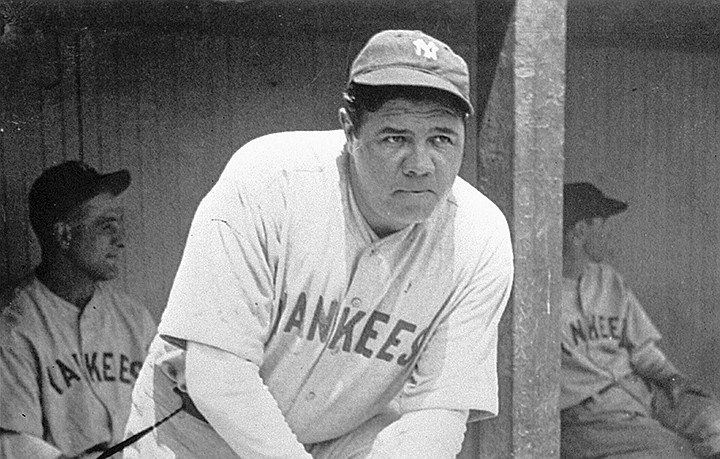 FILE - In this July 1929 file photo, New York Yankees' Babe Ruth, who was injured, stands in the dugout during the baseball team's game at Cleveland. A Babe Ruth road jersey dating to 1928-30 has sold at auction for $5.6 million. Hunt Auctions, which handled Saturday's sale, says the price breaks a record for the most expensive piece of sports memorabilia ever sold. A Ruth jersey from 1920 previously sold for $4.4 million. (AP Photo, File)