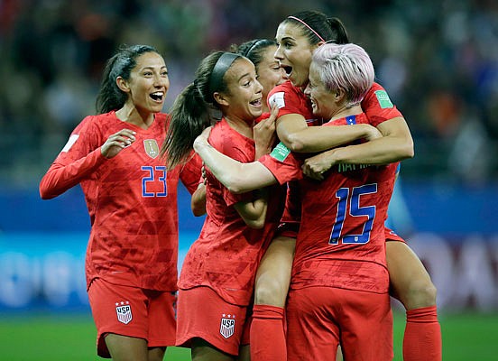 Alex Morgan (second from the right) celebrates Tuesday with her U.S. teammates after scoring her side's 12th goal during the Women's World Cup Group F match against Thailand at the Stade Auguste-Delaune in Reims, France. Morgan scored five goals during the match.
