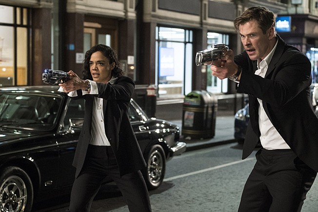 This image released by Sony Pictures shows Tessa Thompson and Chris Hemsworth in a scene from Columbia Pictures' "Men in Black: International." 