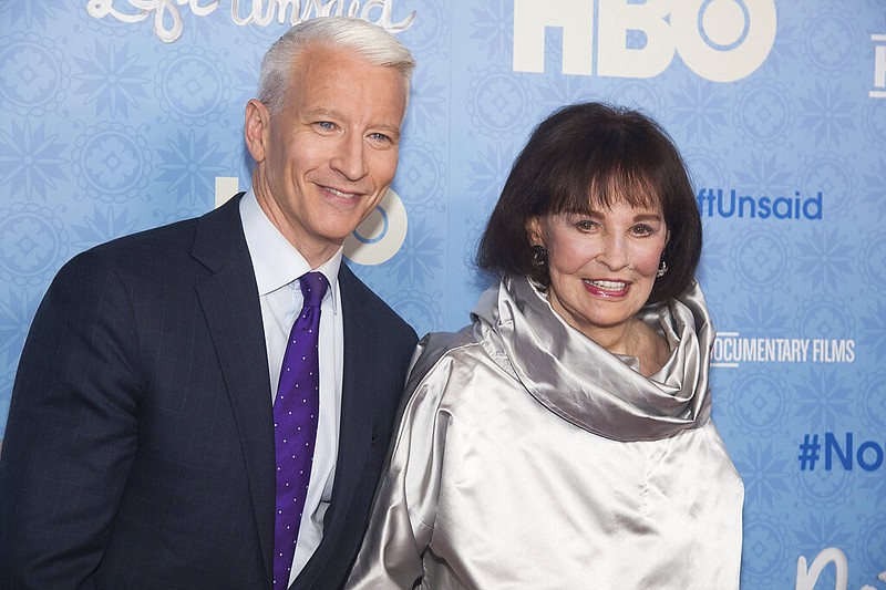 In this April 4, 2016 file photo, CNN anchor Anderson Cooper and Gloria Vanderbilt attend the premiere of "Nothing Left Unsaid" at the Time Warner Center in New York. Vanderbilt, the "poor little rich girl" heiress at the center of a scandalous custody battle of the 1930s and the designer jeans queen of the 1970s and '80s, died on Monday, June 17, 2019, at 95, according to her son, Cooper. (Photo by Charles Sykes/Invision/AP, File)