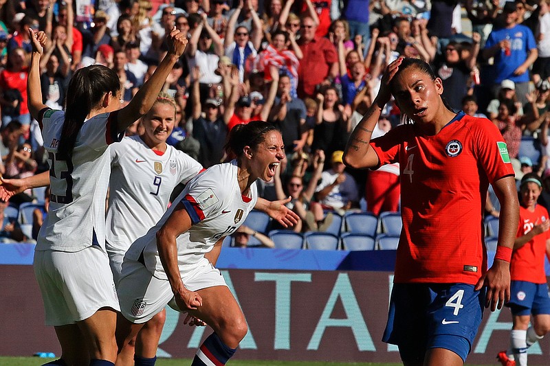 United States' Carli Lloyd, center, celebrates with teammates Sunday, June 16, 2019, after scoring their side's third goal during the Women's World Cup Group F soccer match between United States and Chile at Parc des Princes in Paris, France.