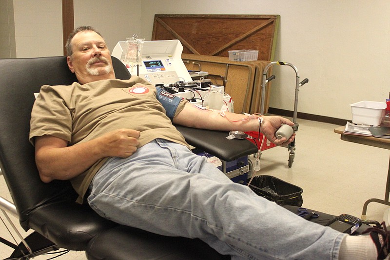 Tim Baker of California sits back and donates blood June 12 at St. Paul's Lutheran Church. Baker said he has donated units "quite a bit" as he does his part to give blood each time there is a Moniteau County blood drive.