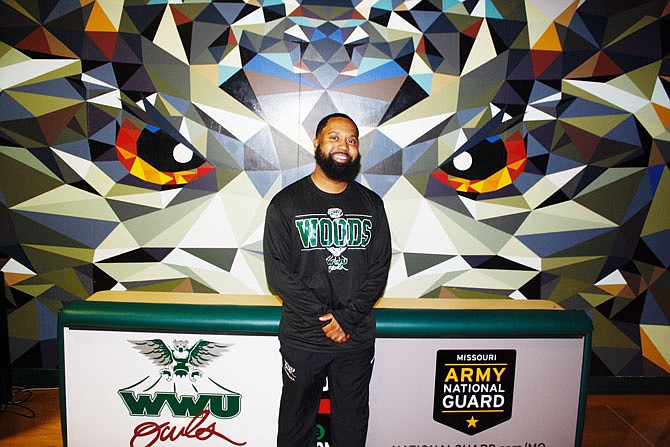 William Woods University head men's basketball coach Charles Belt is pictured in the WWU gymnasium. This is Belt's first head coaching job in his nine-year coaching career.