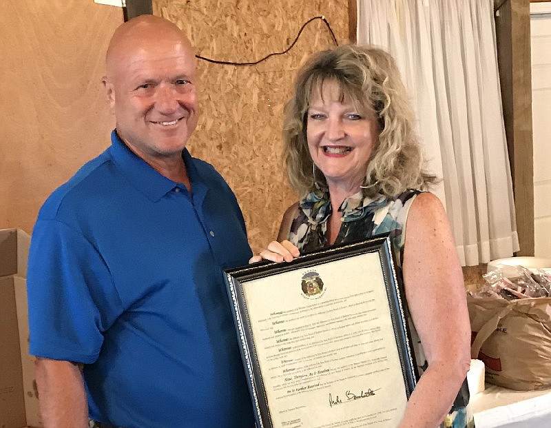 Sen. Mike Bernskoetter presents Board President Stephanie Biggs with a proclamation June 9, 2019, recognizing the Jefferson City Area Board of Realtors' 75th anniversary. (Submitted photo)