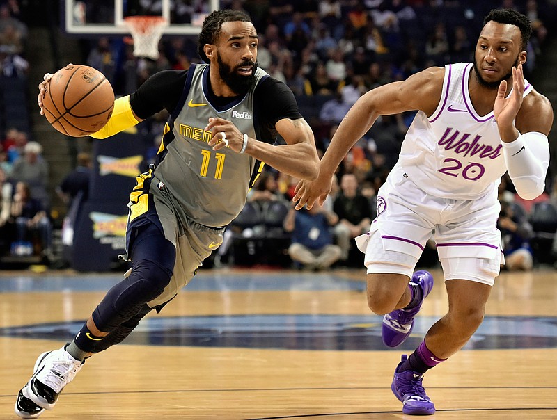 FILE - In this March 23, 2019, file photo, Memphis Grizzlies guard Mike Conley (11) handles the ball against Minnesota Timberwolves guard Josh Okogie (20) in the first half of an NBA basketball game, in Memphis, Tenn. A person with knowledge of the decision says the Memphis Grizzlies have traded veteran point guard Mike Conley, who has played the most games in franchise history, to the Utah Jazz. The person says the Grizzlies swapped Conley for Jae Crowder, Kyle Korver and Grayson Allen. The person spoke to The Associated Press Wednesday, June 19, 2019, on condition of anonymity because neither Memphis nor Utah has announced the trade.