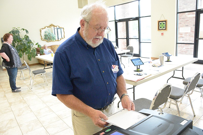 Macey Jett casts a vote in the Ward 2 alderman race Tuesday at Union Hill Baptist Church in Holts Summit. The election decided a tied race between Lisa Buhr and Chris Redel.