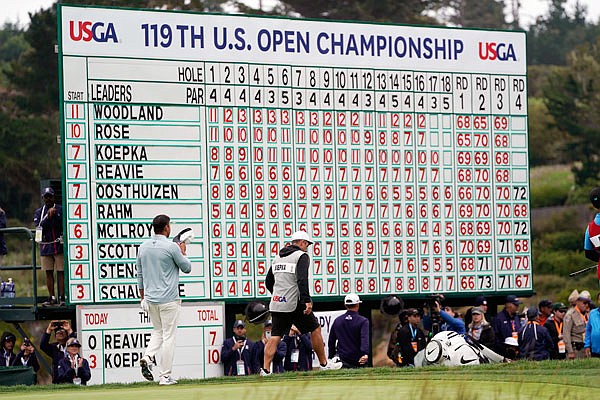 Brooks Koepka walks off on the 18th green in Sunday's final round of the U.S. Open in Pebble Beach, Calif.