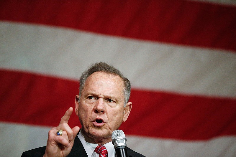In this Dec. 5, 2017, file photo, former Alabama Chief Justice and U.S. Senate candidate Roy Moore speaks at a campaign rally, in Fairhope Ala. Moore's wife, Kayla Moore, confirmed that he will make an announcement on the U.S. Senate race in 2020 Thursday, June 20, 2019. Moore ran for U.S. Senate in 2017, but lost the special election amid allegations of long ago sexual misconduct with teenagers. (AP Photo/Brynn Anderson, File)