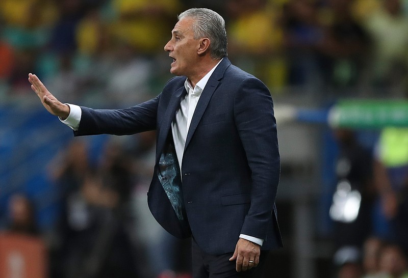 Brazil's coach Tite gives instructions to his players during a Copa America Group A soccer match against Venezuela at the Arena Fonte Nova in Salvador, Brazil, Tuesday, June 18, 2019. 