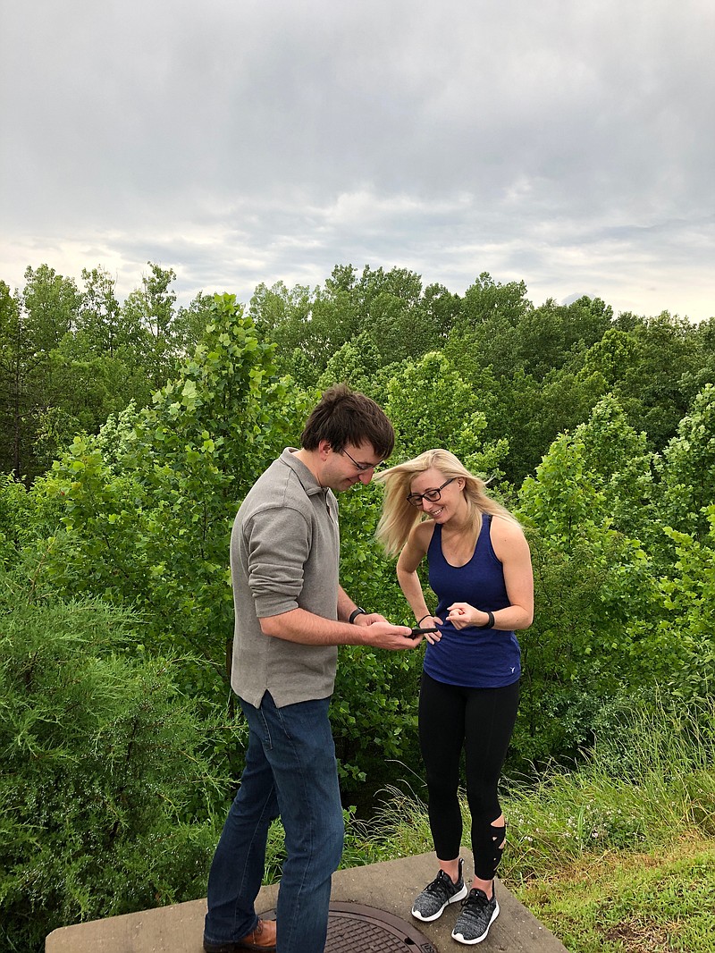 John Fandrey, creator of Atropine, and Kayla Smith, vice president of marketing for Karst Games, demonstrate how to play Atropine. (Courtesy of John Fandrey.)