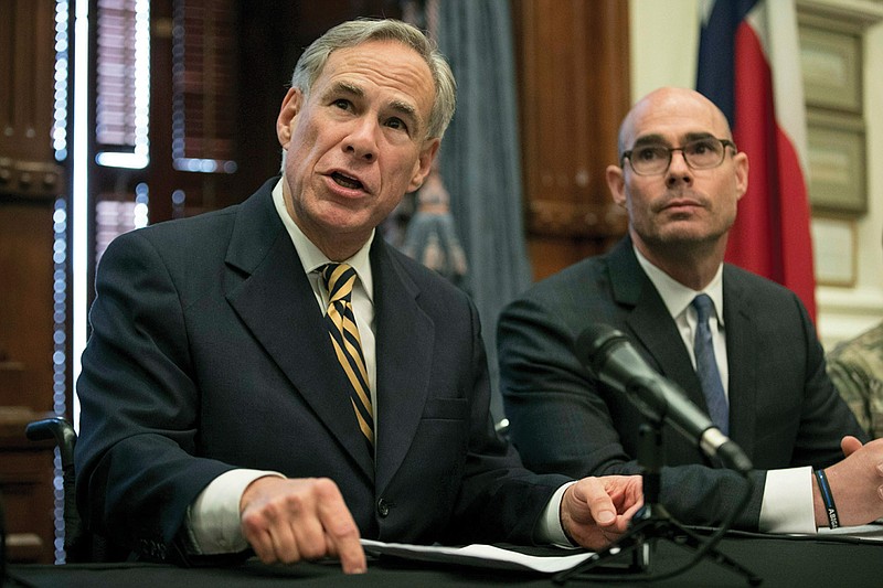 Gov. Greg Abbott announces a deployment of National Guard troops to the Texas-Mexico border at a news conference at the Capitol, Friday June 21, 2019 in Austin, Texas. Texas Gov. Greg Abbott says he's sending another 1,000 National Guard troops to the U.S.-Mexico border and blasted Congress as a "group of reprobates" over the growing humanitarian crisis.Listening is House Speaker Dennis Bonnen, right. (Jay Janner/Austin American-Statesman via AP)