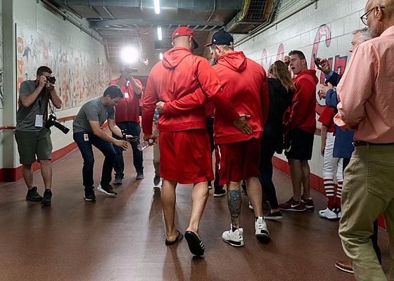 Former teammates Albert Pujols and Yadi Molina hug after Pujols' press conference Friday at Busch Stadium.