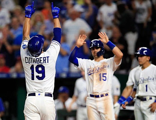 Cheslor Cuthbert of the Royals celebrates with teammate Whit Merrifield after hitting a three-run home run during the fifth inning of Friday night's game against the Twins at Kauffman Stadium.