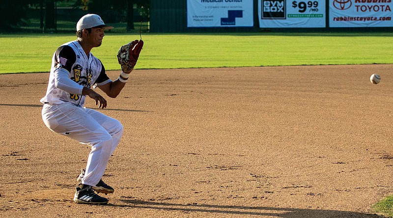 Texarkana Twins third baseman Shea Guterrez catches the ball and throws it to the first base for an out against the Acadiana Cane Cutters on Friday at George Dobson Field in Spring Lake Park in Texarkana, Texas. 