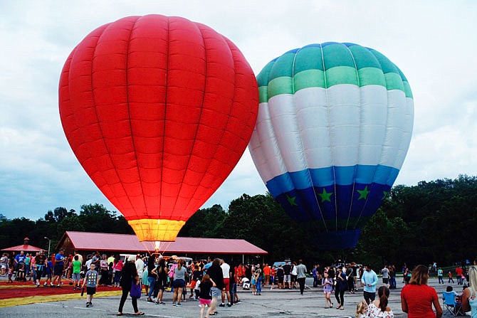 Two hot air balloons were on display at the balloon glow Friday night in Memorial Park. Originally, eight to 10 were to be on display, but adverse weather kept them away.
