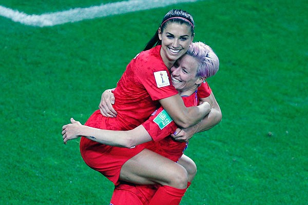 Megan Rapinoe (right) congratulates teammate Alex Morgan after scoring her fifth goal during Tuesday's game against Thailand in Women's World Cup in Reims, France,.