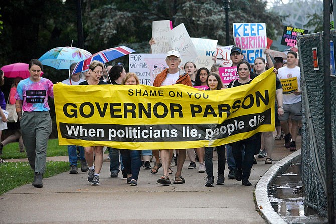 Abortion rights activists rally Saturday outside the Missouri Capitol. The rally came a day after the state momentarily lost its only remaining abortion clinic in St. Louis.