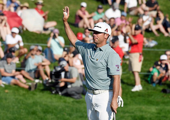 Chez Reavie waves to the crowd Sunday after winning the Travelers Championship in Cromwell, Conn.